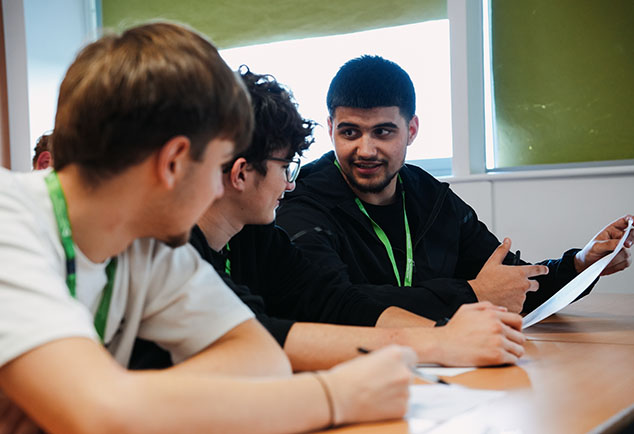 Students sitting at a table working together