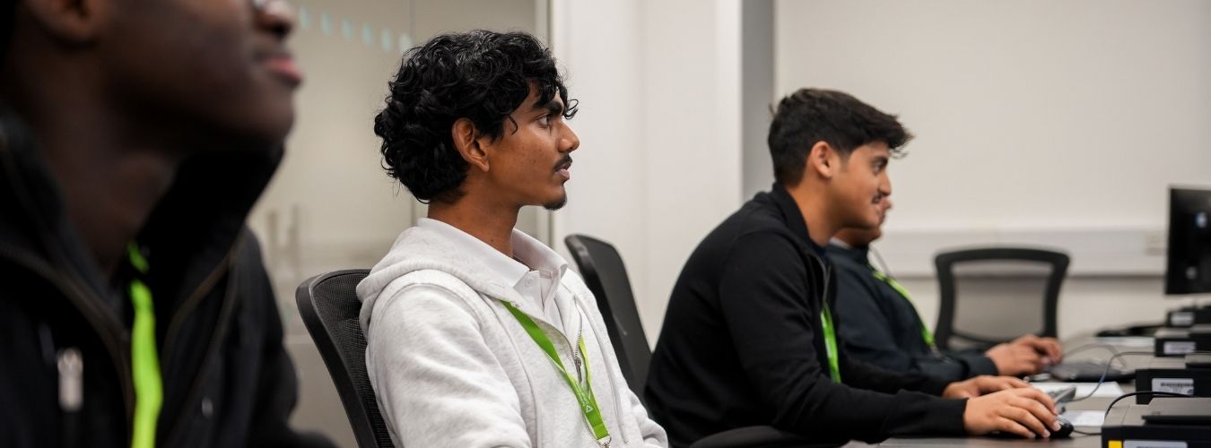 Students sitting in front of of computers