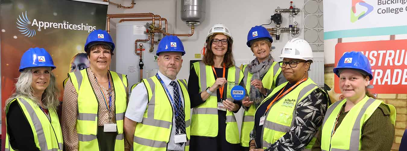 Staff from Buckinghamshire College Group standing with an representatives of Morgan Sindal