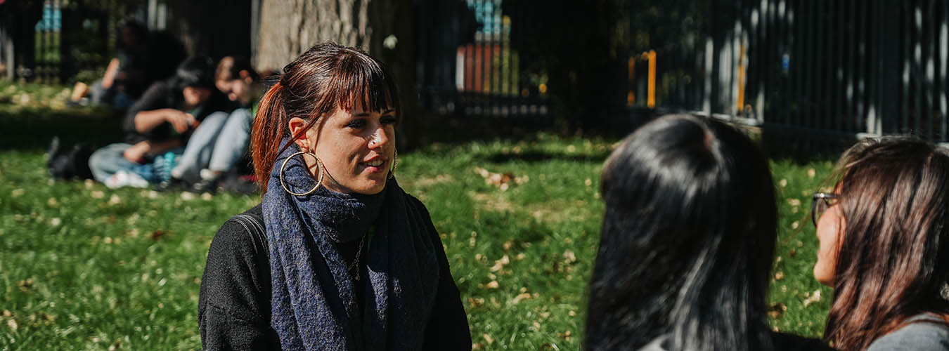 Students sitting outside talking