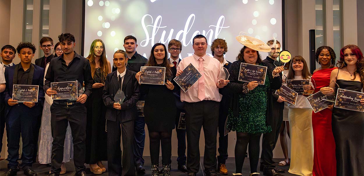 Student Award 2025 winners standing on stage holding awards