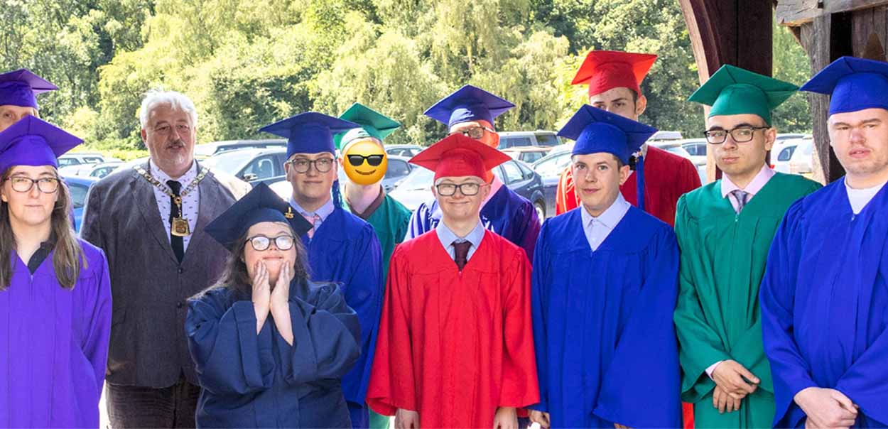 Mission Employable Graduates standing wearing coloured graduation gowns